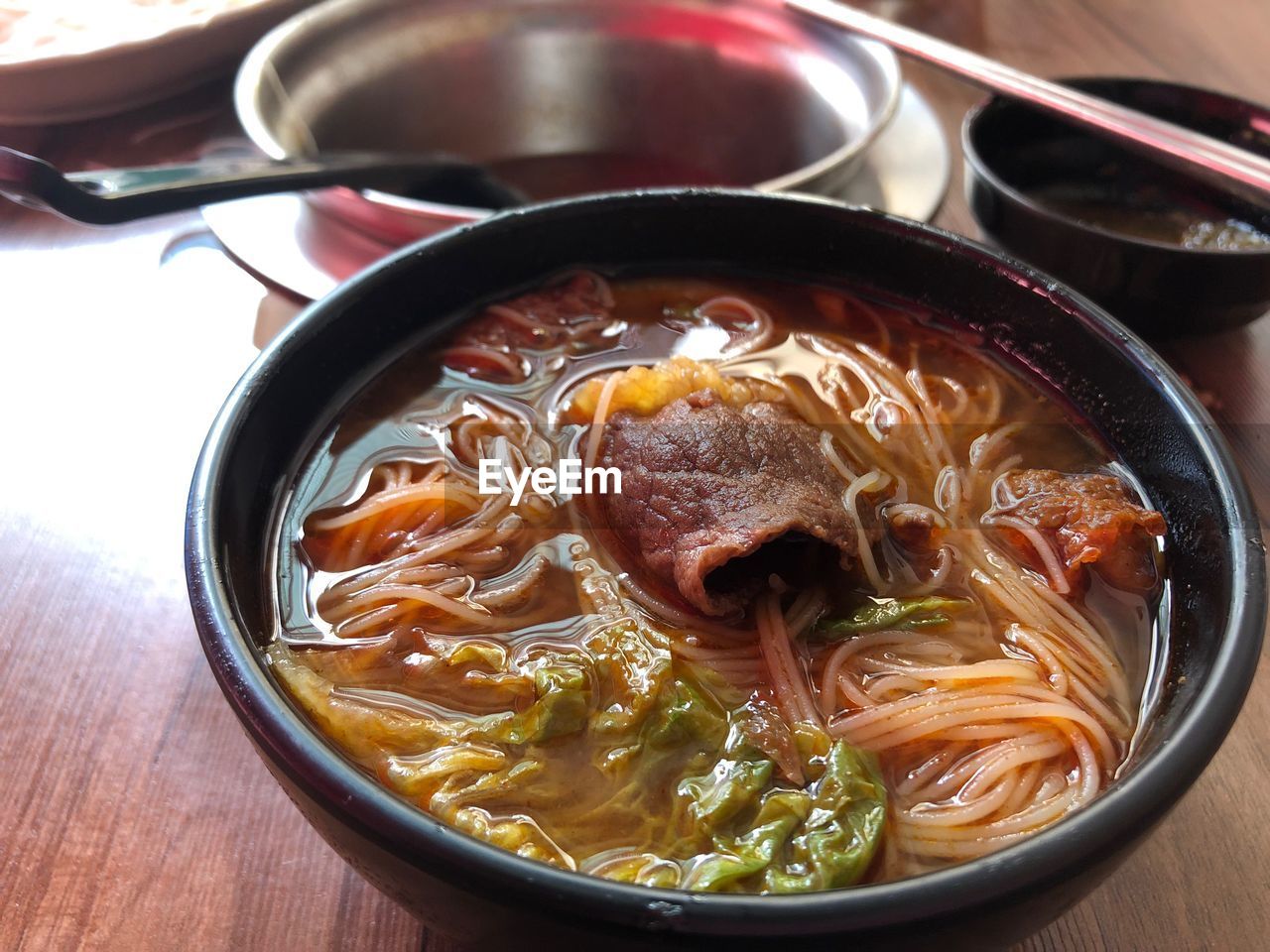 CLOSE-UP OF SOUP IN BOWL ON TABLE