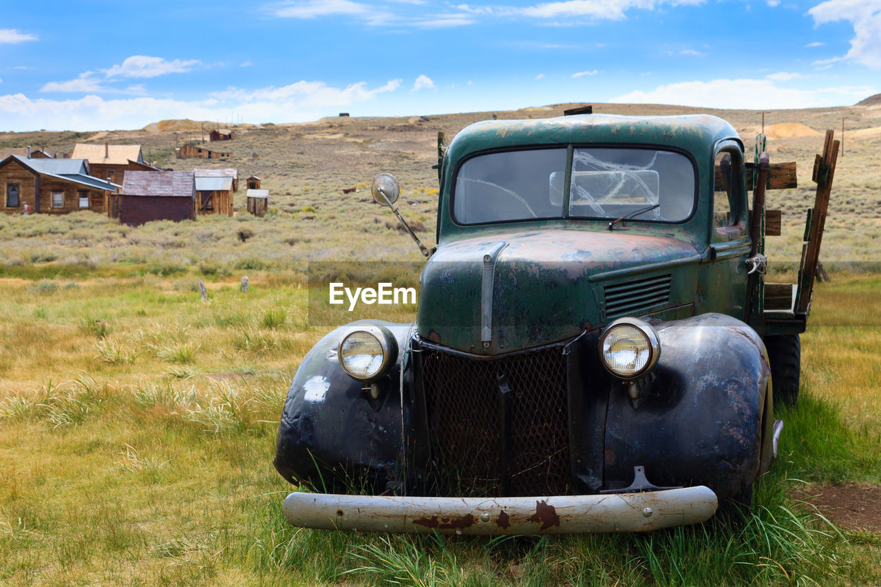 ABANDONED VINTAGE CAR ON LAND