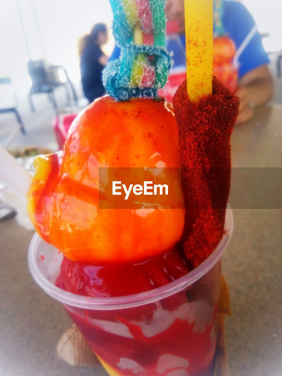 CLOSE-UP OF ICE CREAM WITH FRUITS ON TABLE
