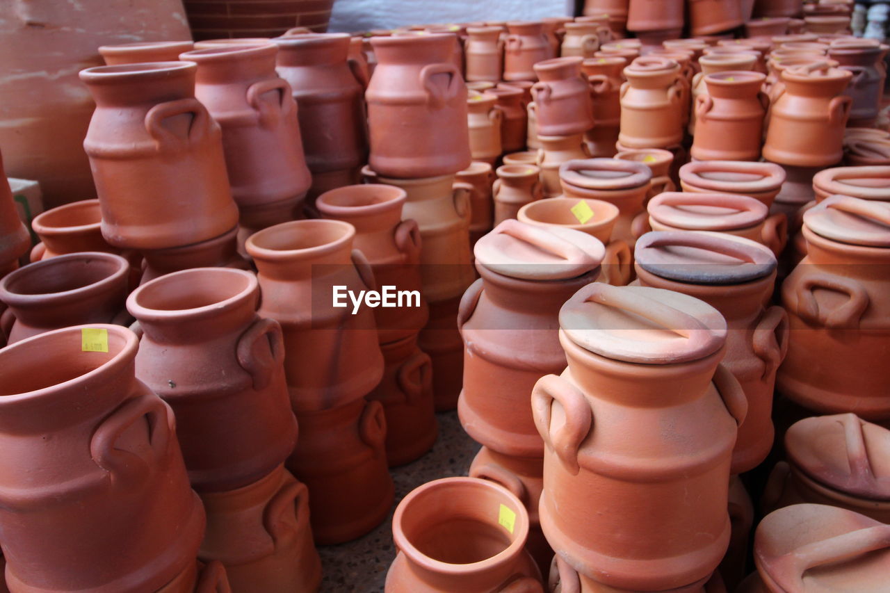 CLOSE-UP OF OBJECTS FOR SALE AT MARKET STALL