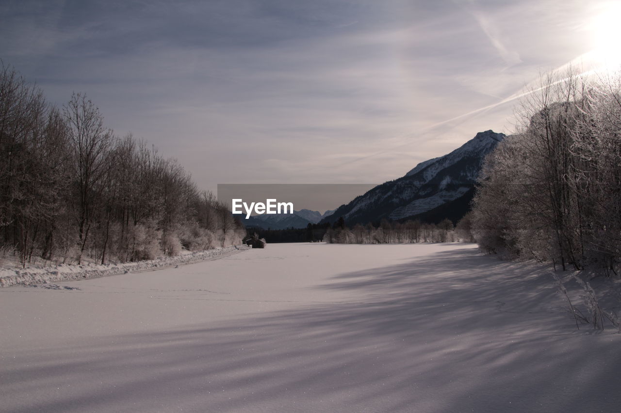 Scenic view of snowcapped mountains against sky during winter