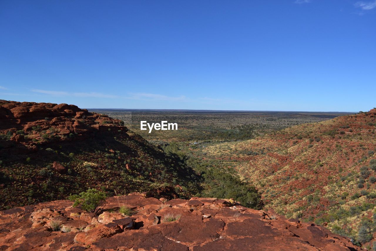 SCENIC VIEW OF LANDSCAPE AGAINST BLUE SKY