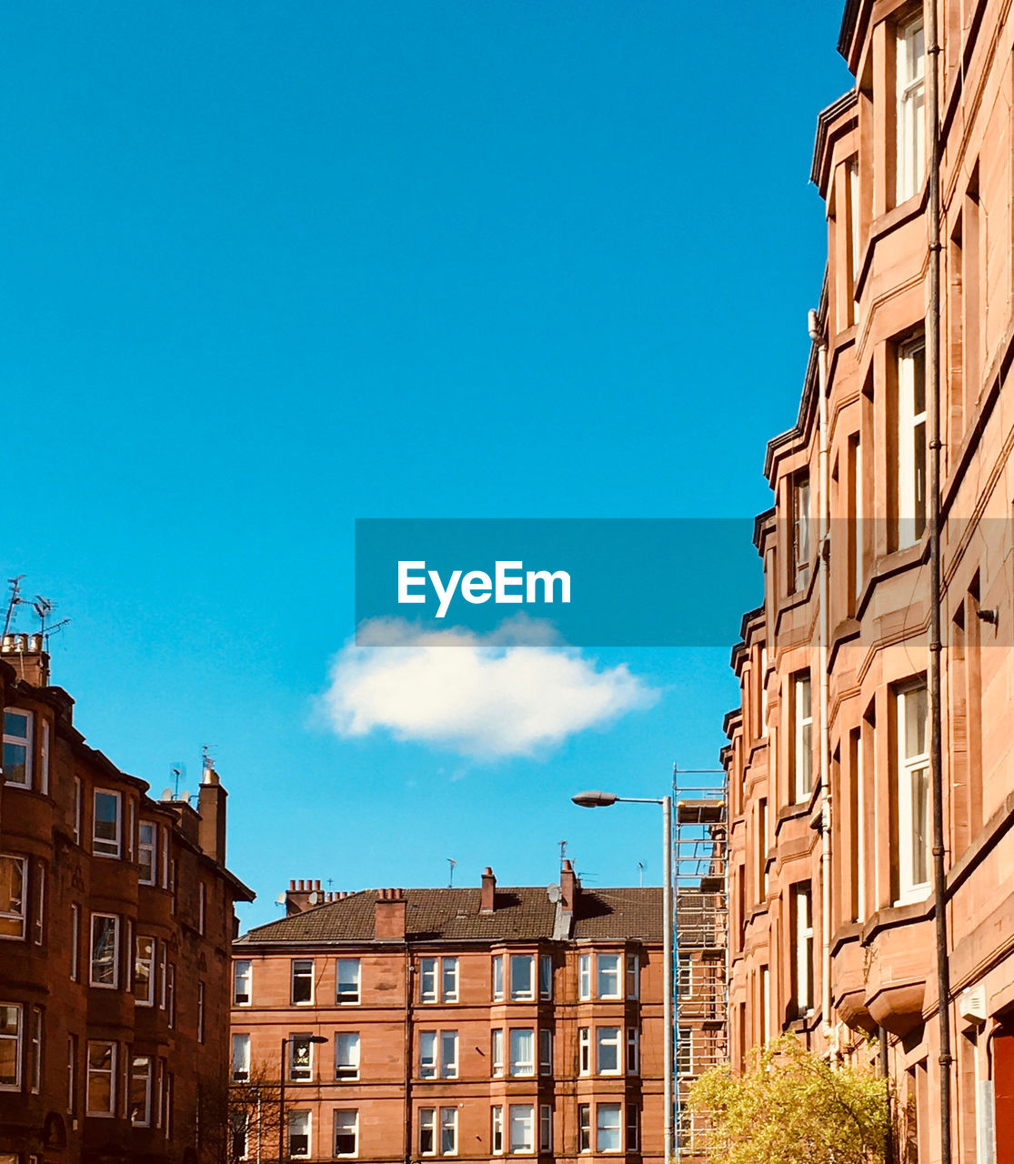 Low angle view of buildings against blue sky