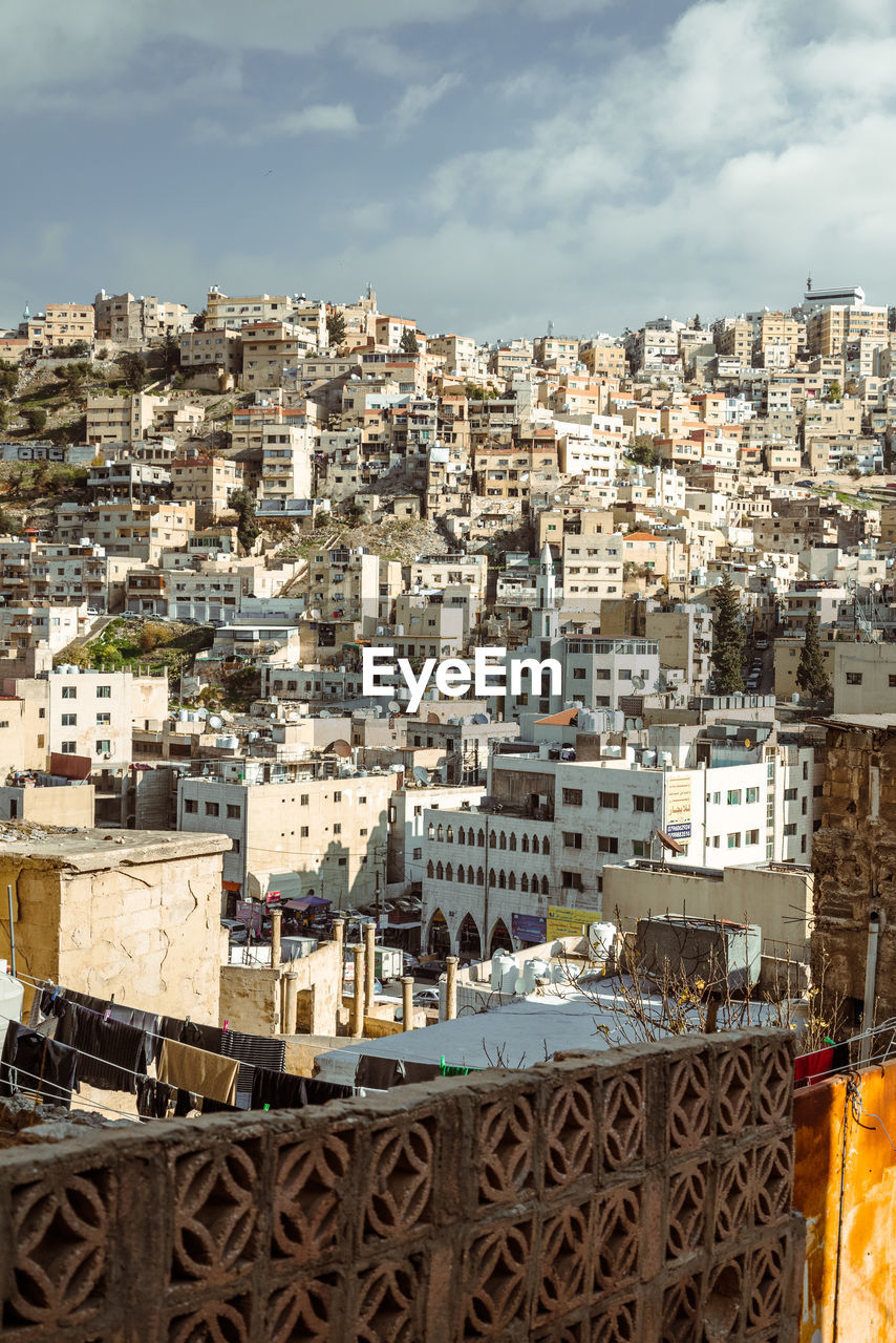 High angle view of buildings in city against sky