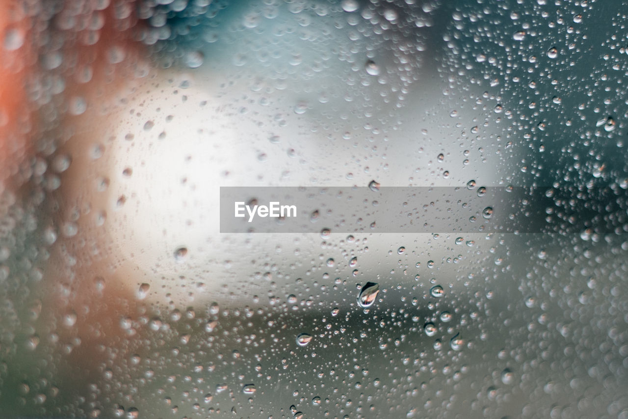 Full frame shot of wet glass window