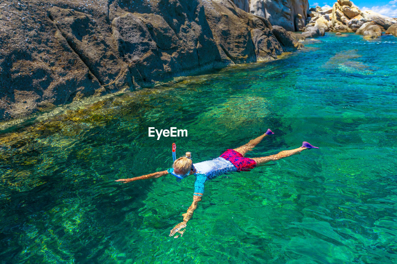 Full length of woman snorkeling in sea