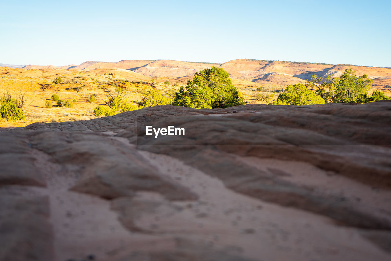 SURFACE LEVEL OF ROCKY LAND AGAINST SKY