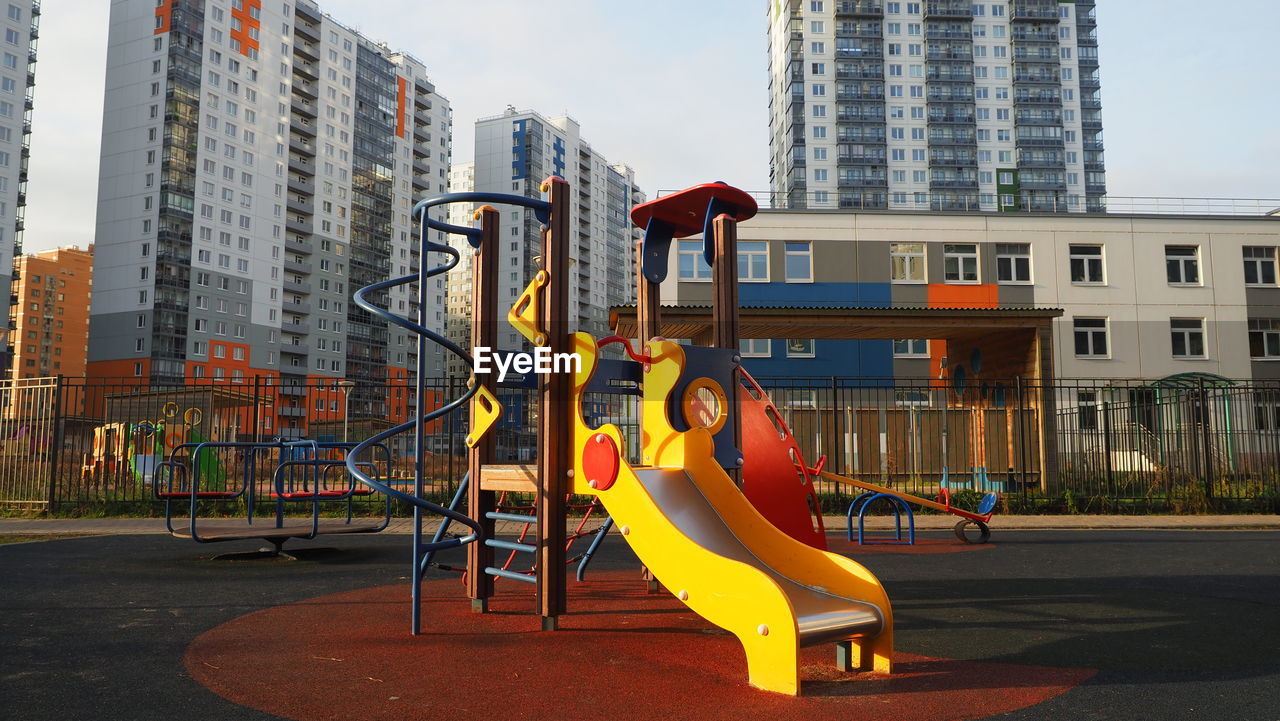 Colorful playground new district. apartment building. development city construction, mortgage family