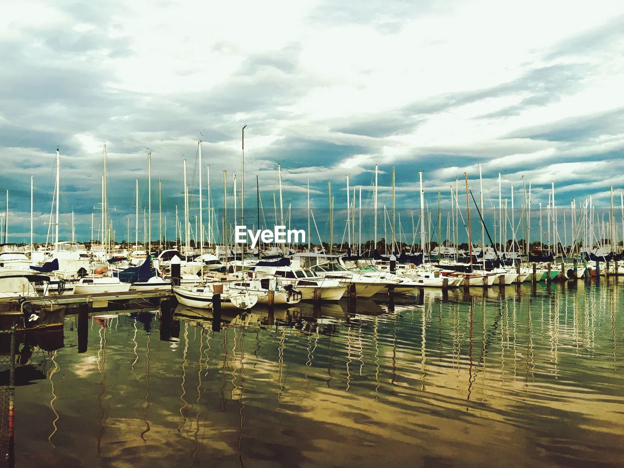 Boats moored at harbor