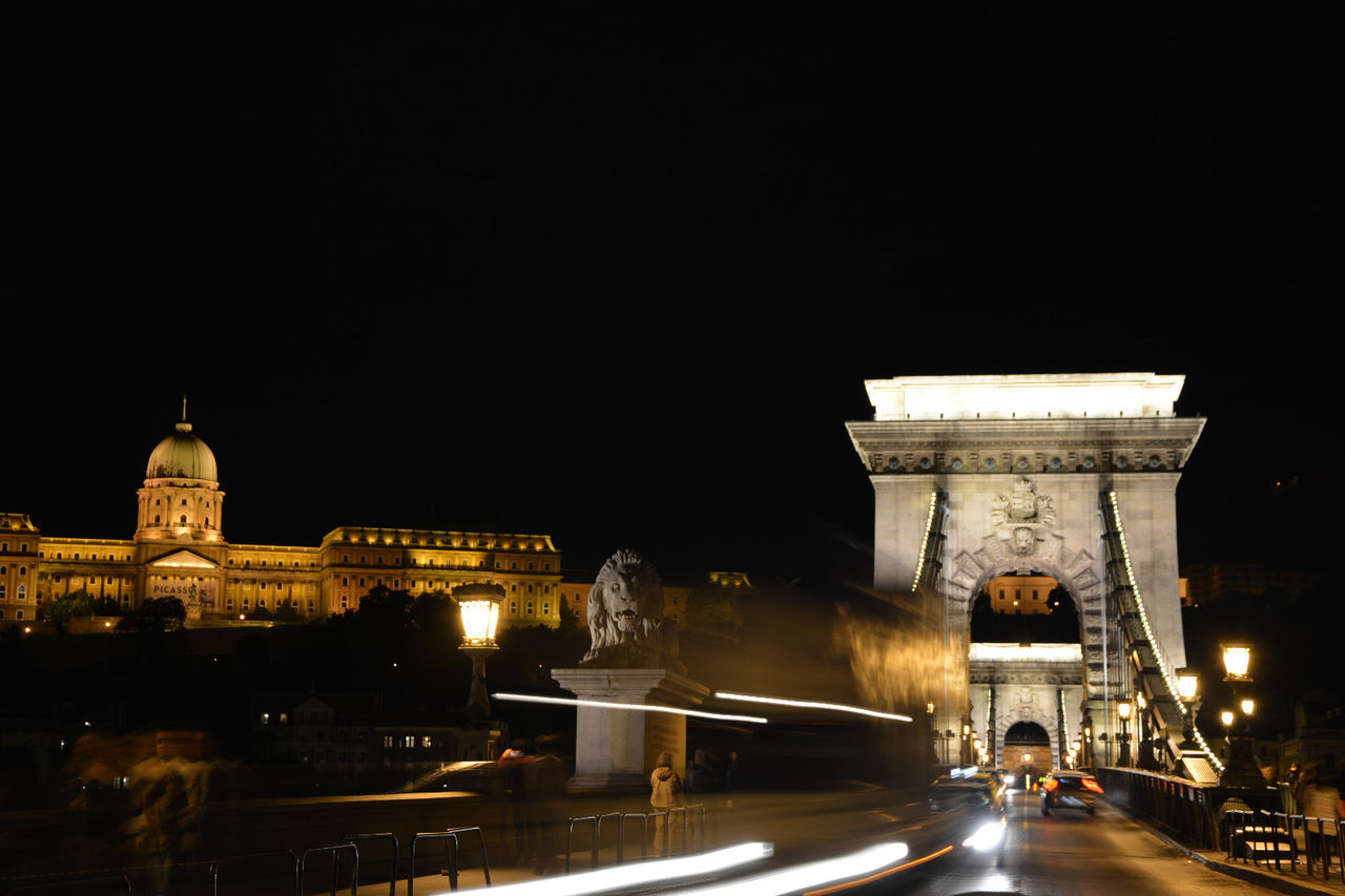 Illuminated bridge at night