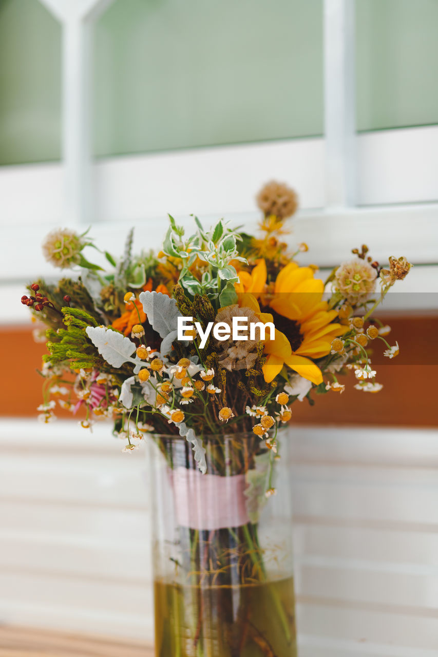 Close-up of flower vase on table