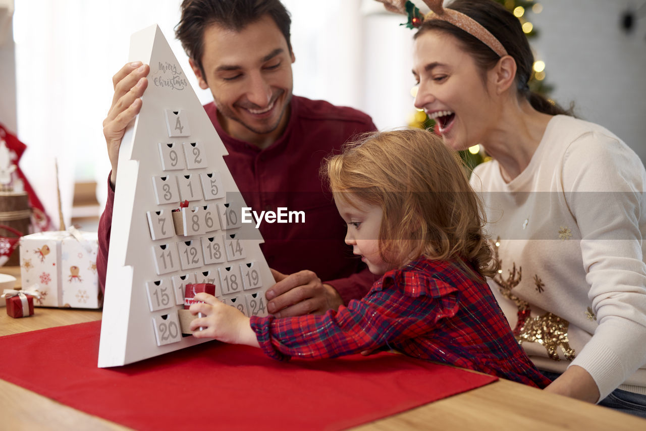 Family playing game at table
