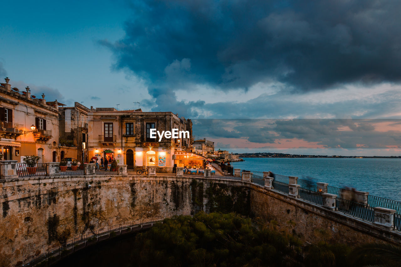 Panoramic view of ortigia with fonte aretusa and lungomare alfeo  during sunset