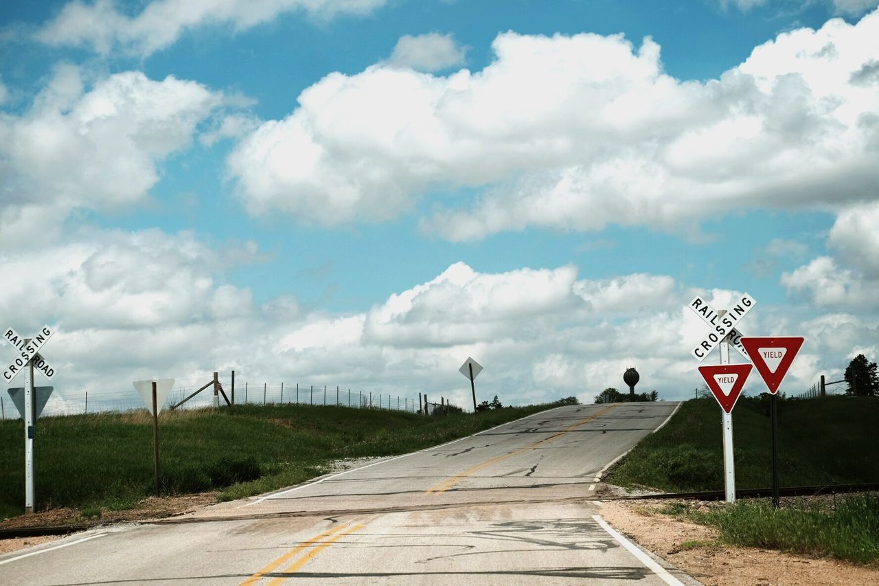 Empty road along countryside landscape