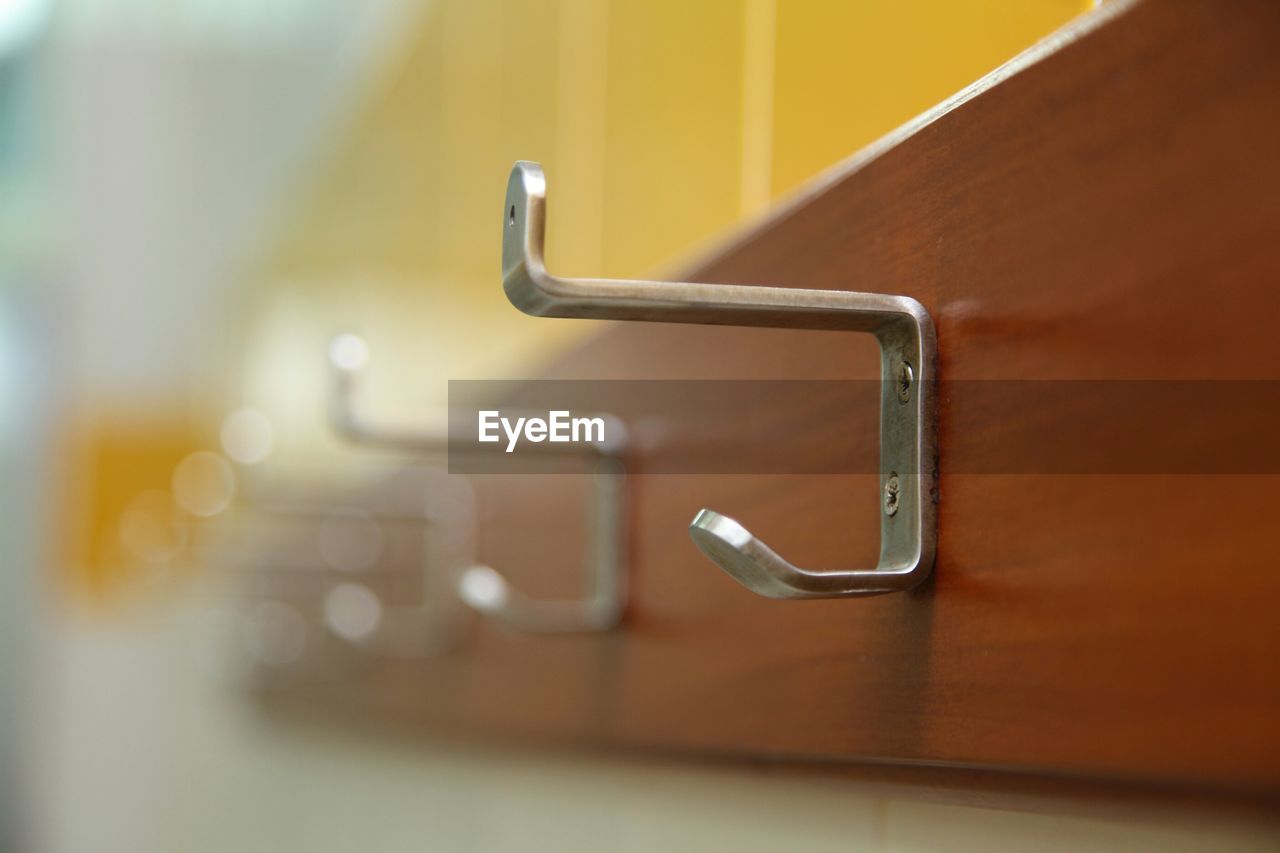 Close-up of hooks in bathroom