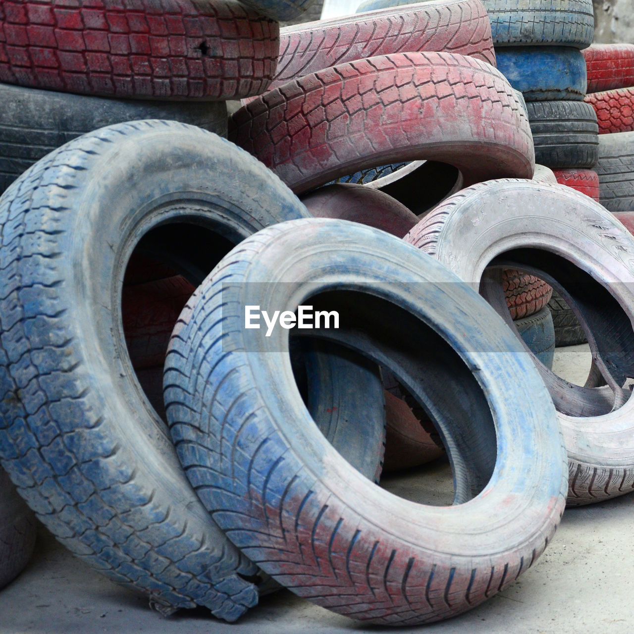 CLOSE-UP OF ABANDONED TIRE ON STREET