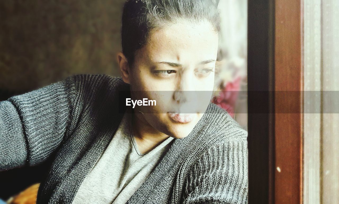 Close-up of young woman smoking