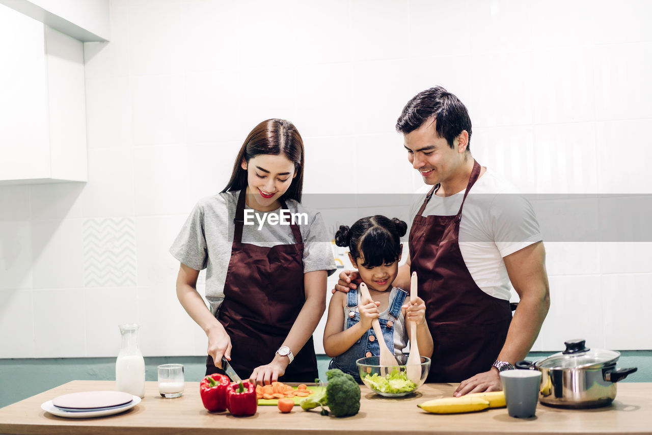 COUPLE AND PREPARING FOOD