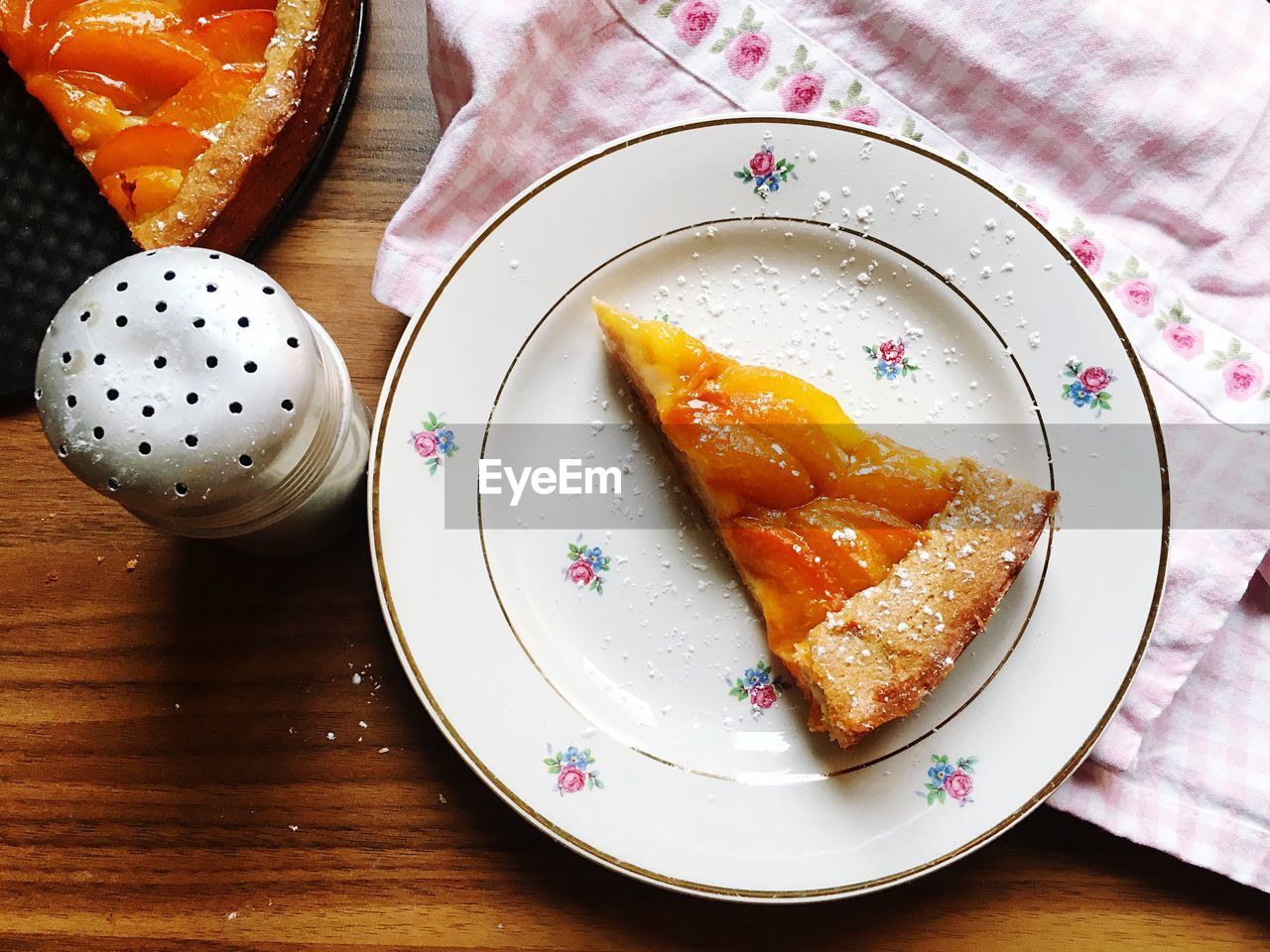 Directly above shot of apricot cake slice on table