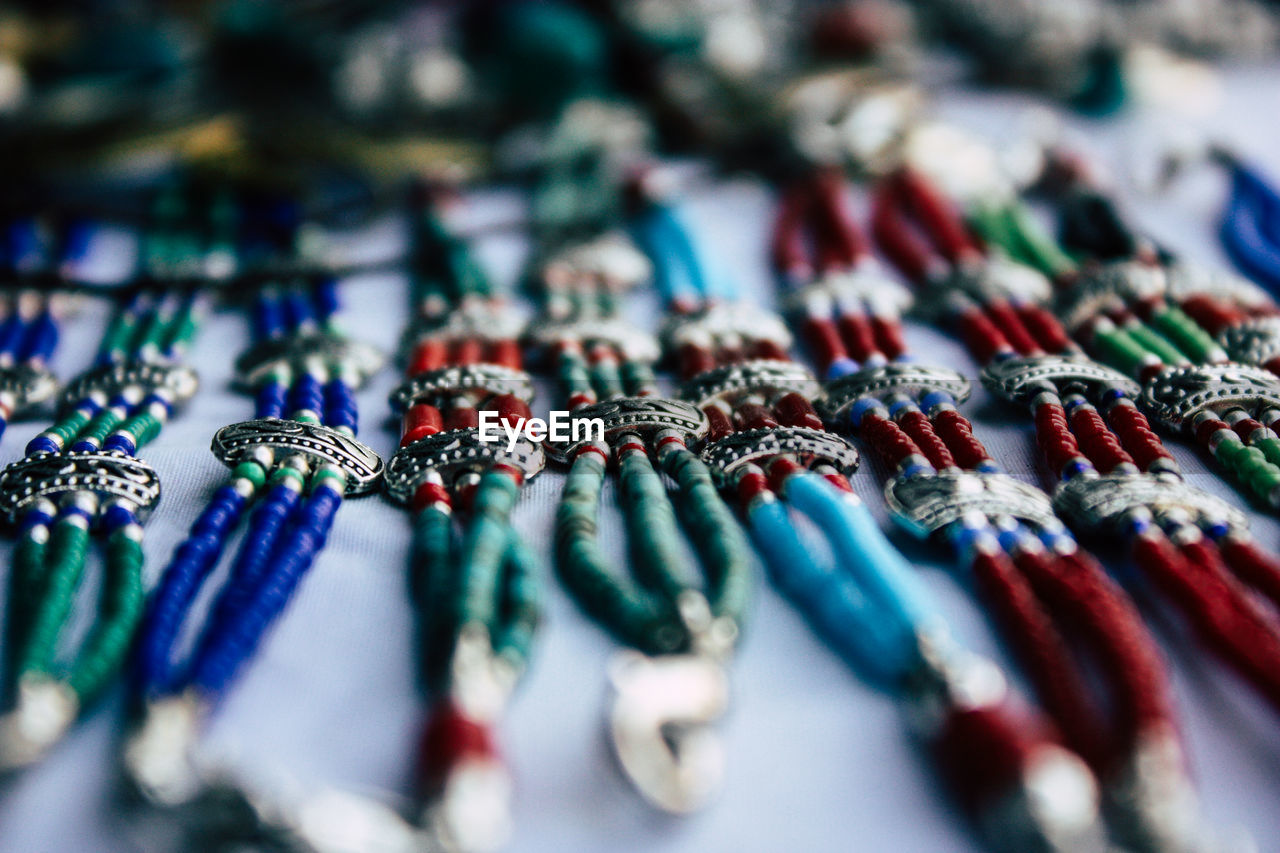 High angle view of multi colored bracelets at market stall
