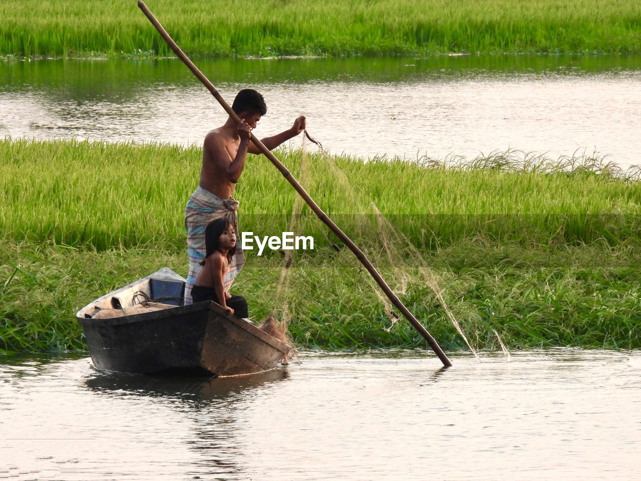 Fisherman fishing in river 