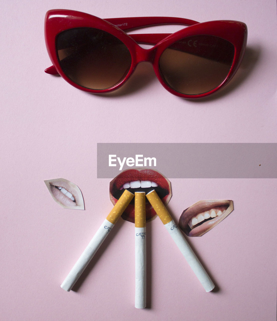 Close-up of eyeglasses and cigarettes on table