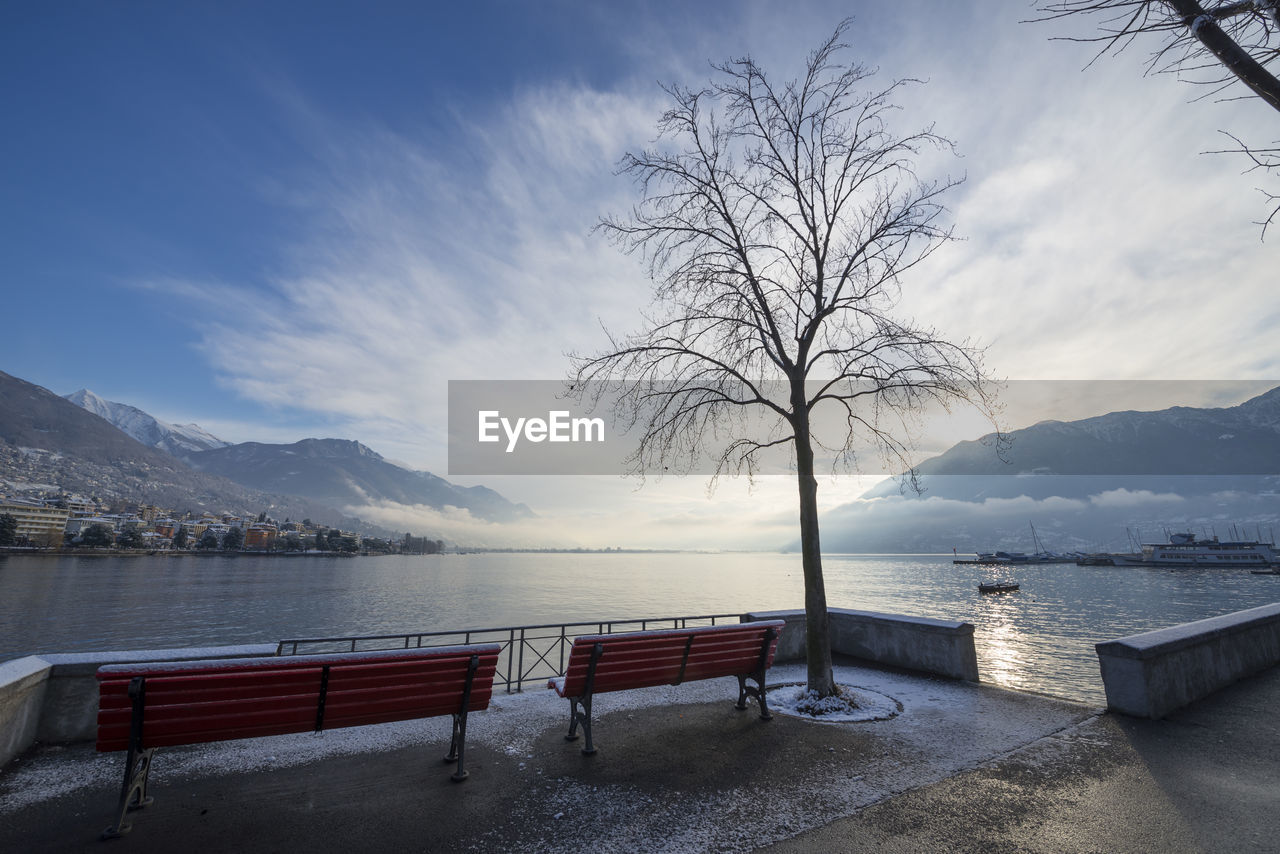 Scenic view of lake against sky during winter