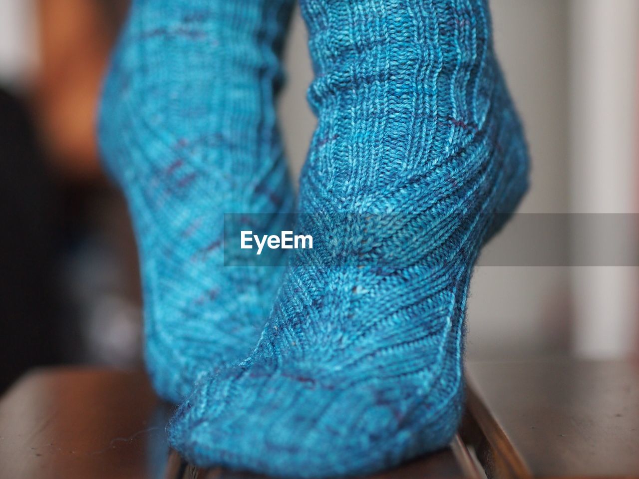 Close-up of feet with blue socks