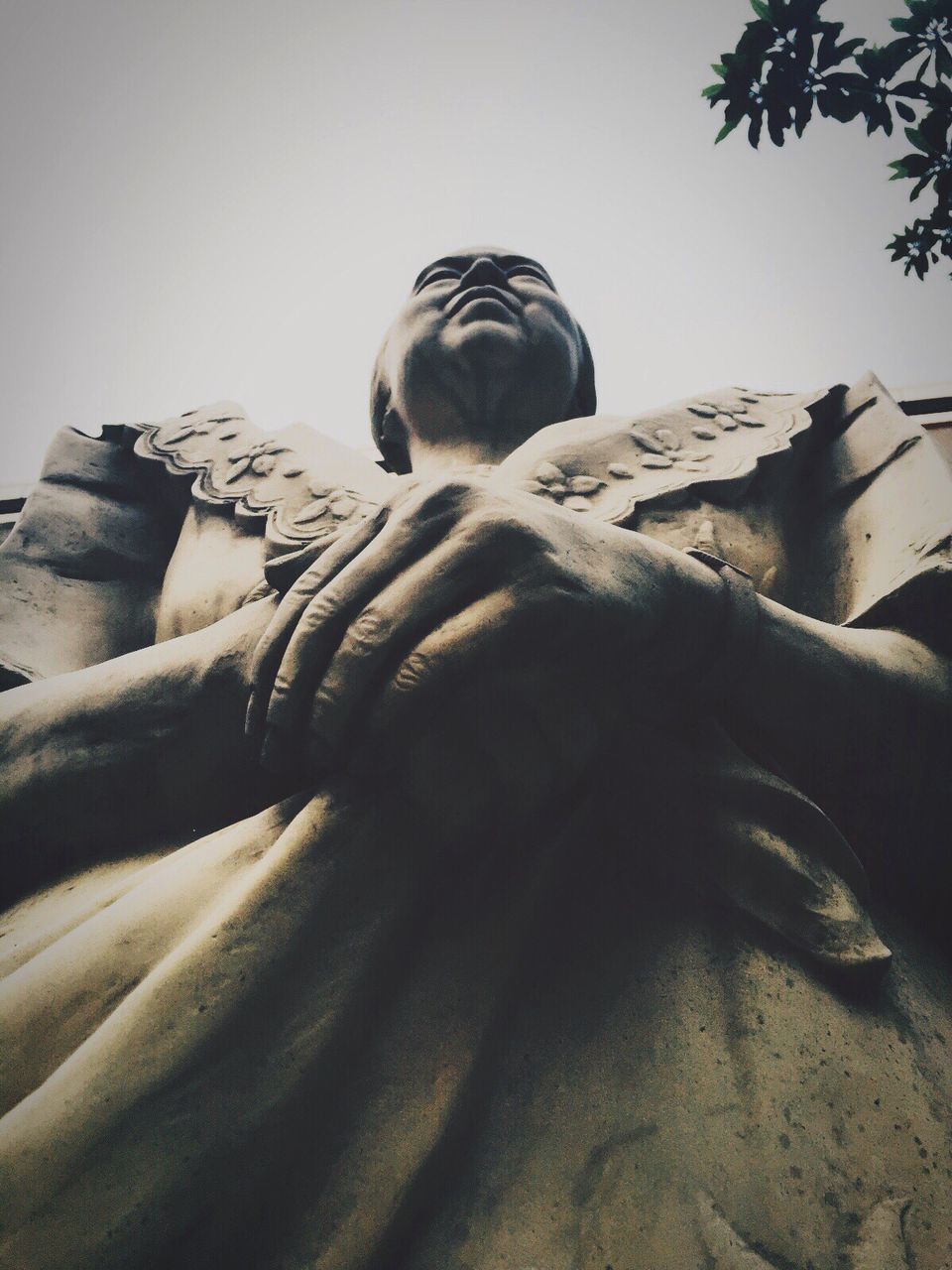 statue, human representation, low angle view, sculpture, male likeness, art and craft, spirituality, day, outdoors, no people, sky, close-up