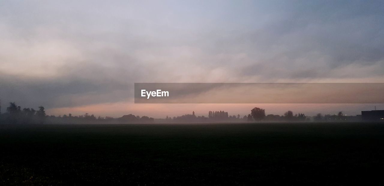 SCENIC VIEW OF FIELD AGAINST SKY DURING SUNSET