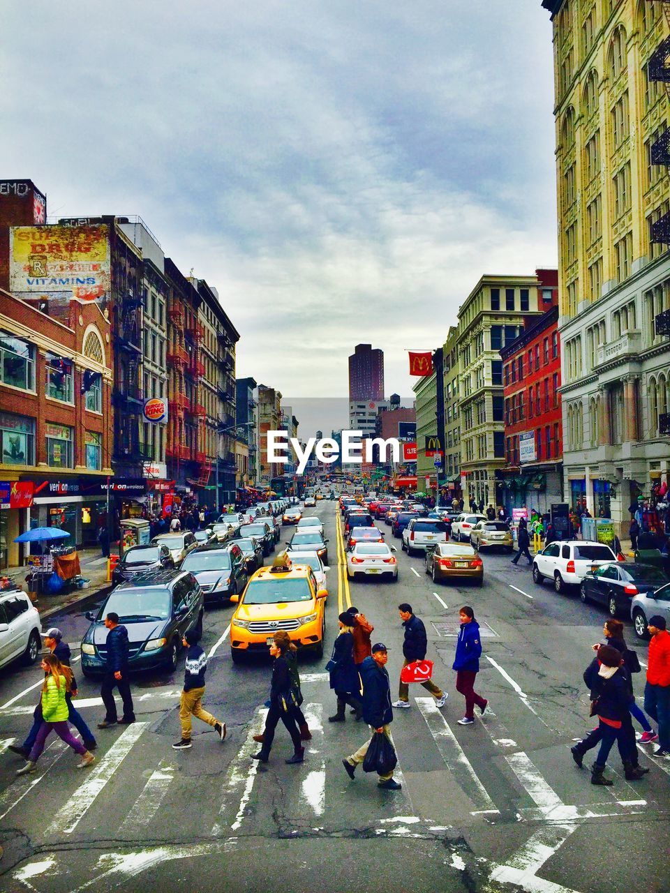 People crossing road in city