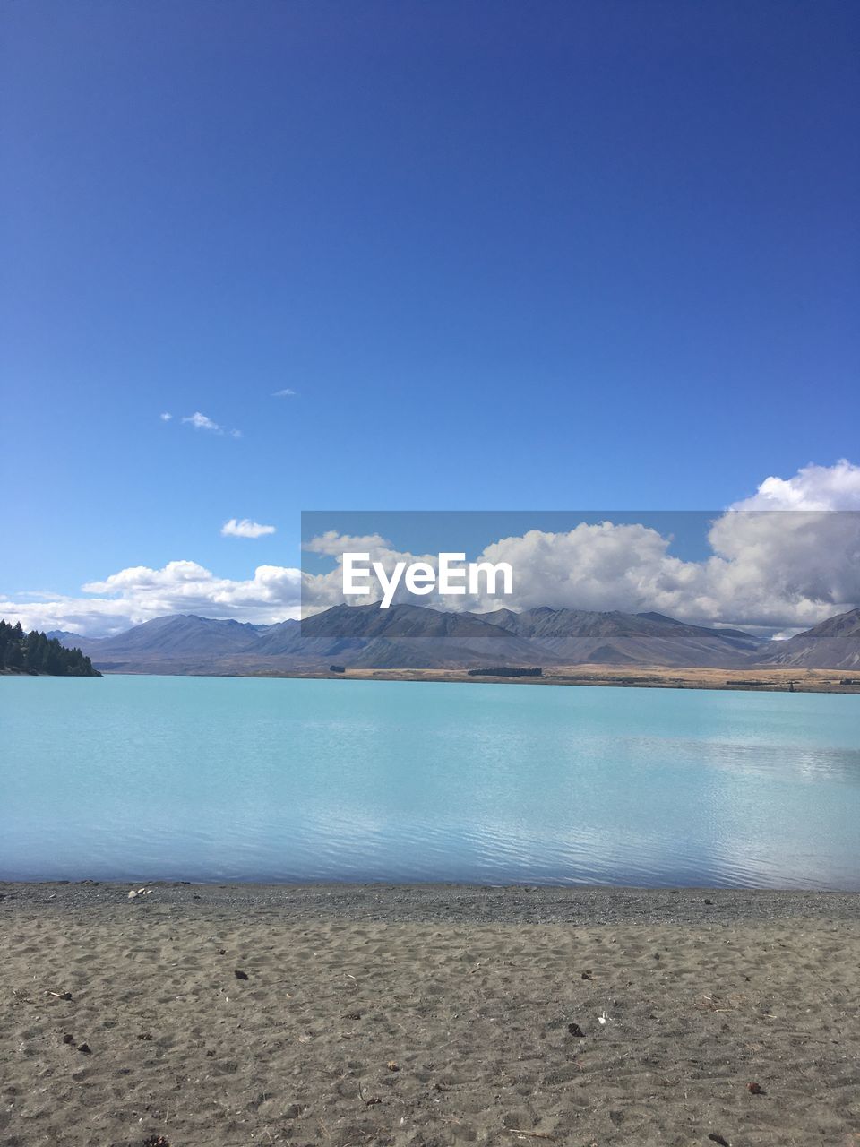 Scenic view of sea against blue sky