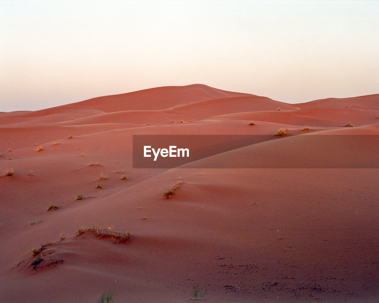 Scenic view of desert against clear sky