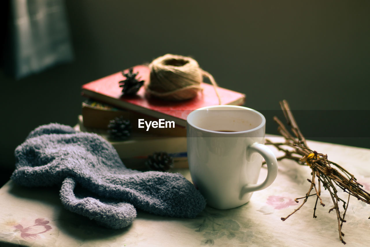 Close-up of coffee cup on table