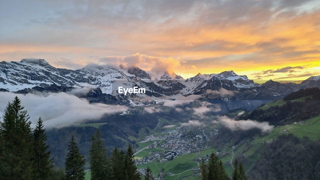 Scenic view of snowcapped mountains against sky during sunset in engelberg 