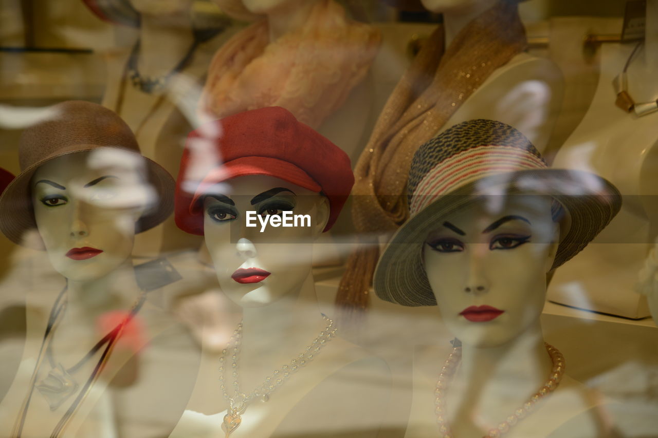 Close-up of hats in mannequins