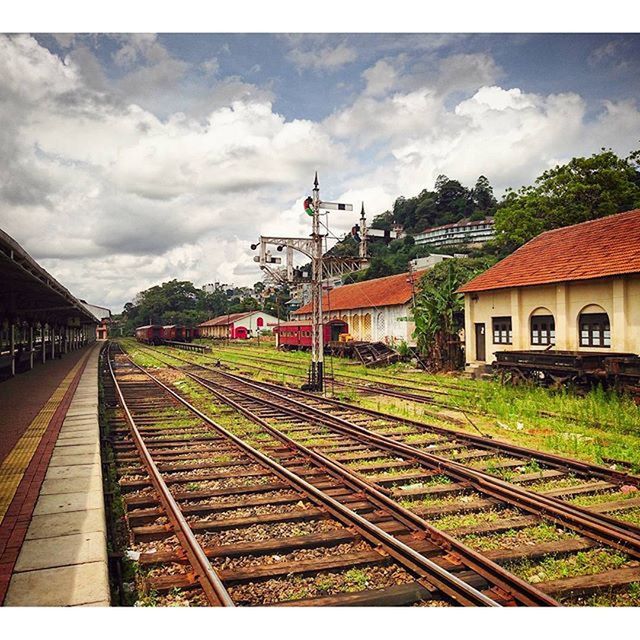 RAILROAD TRACKS ON RAILWAY STATION PLATFORM