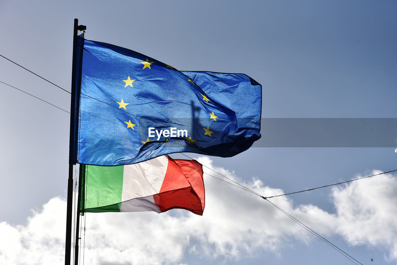 LOW ANGLE VIEW OF FLAG FLAGS AGAINST SKY