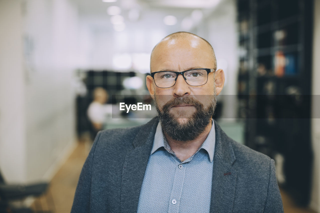 Portrait of mature businessman in office