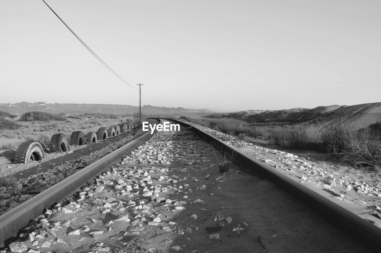 SURFACE LEVEL OF RAILROAD TRACKS AGAINST SKY