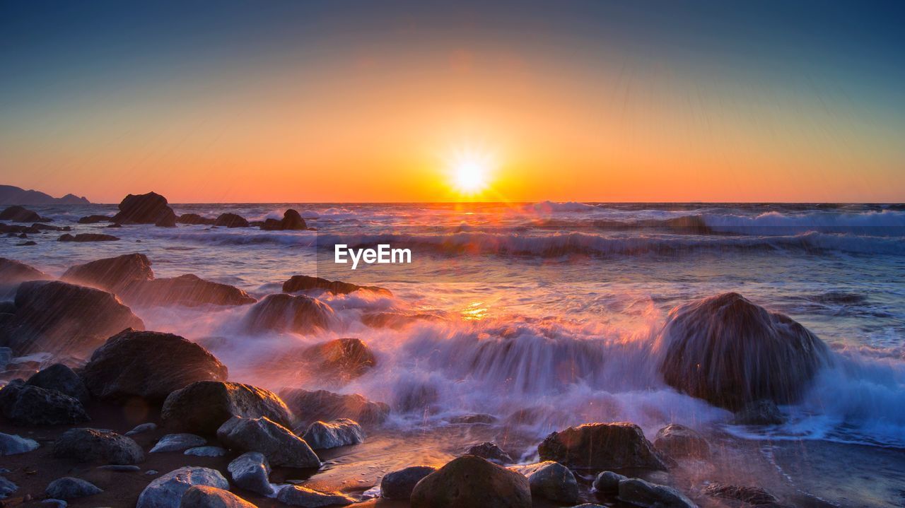 View of calm sea at sunset