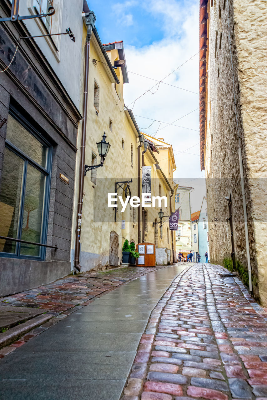 Narrow alley amidst buildings in town