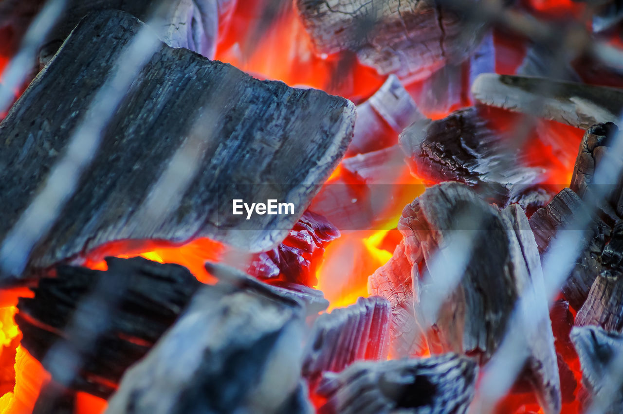 Firewood burning on barbecue grill