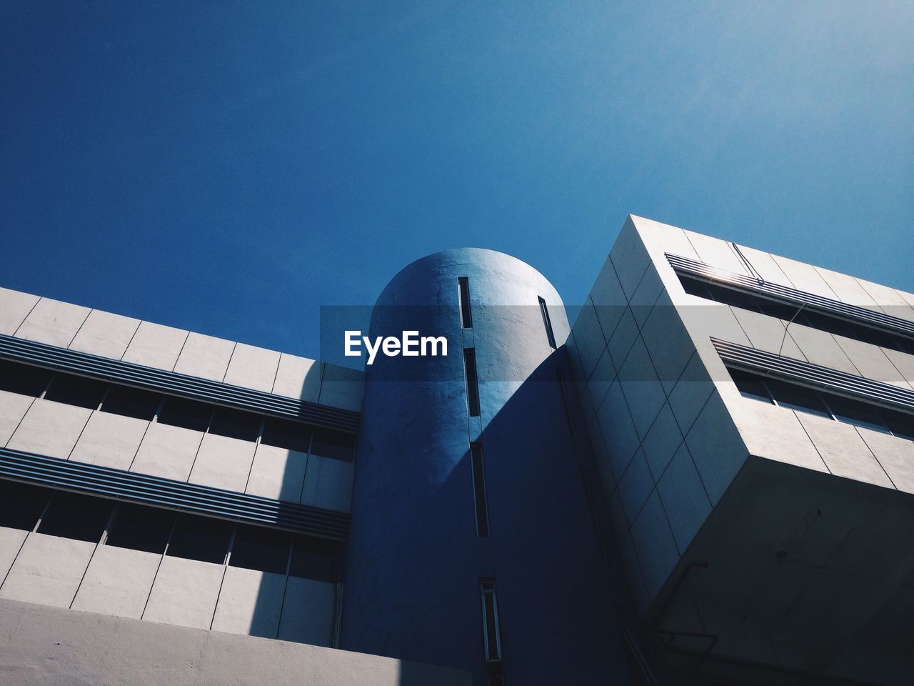 Low angle view of built structure against blue sky