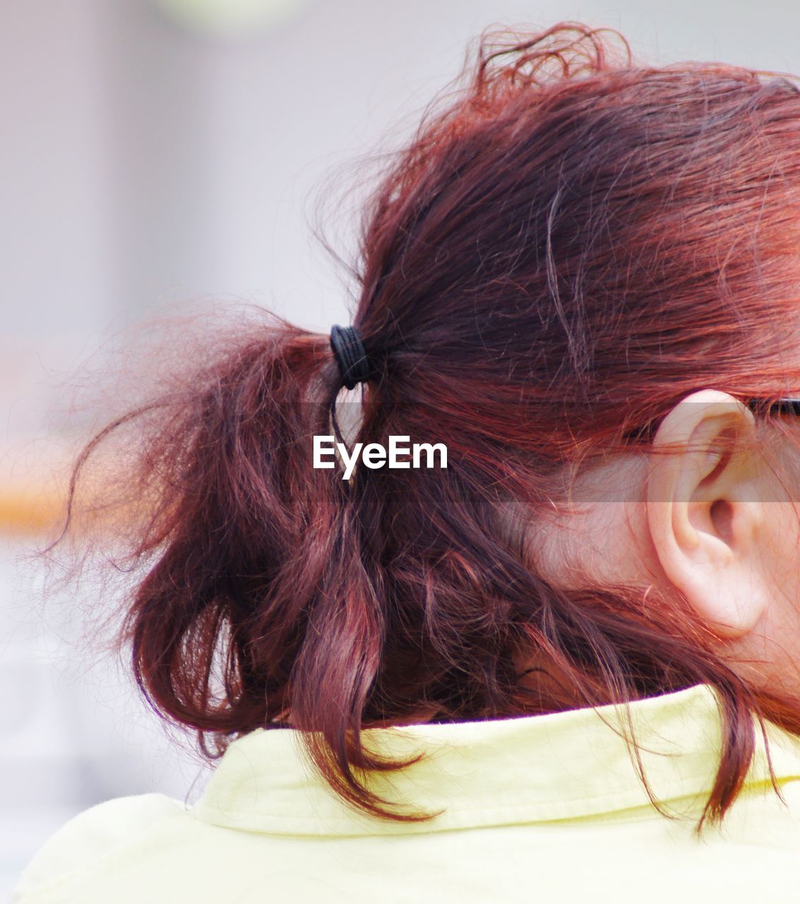 Rear view of redhead woman with ponytail