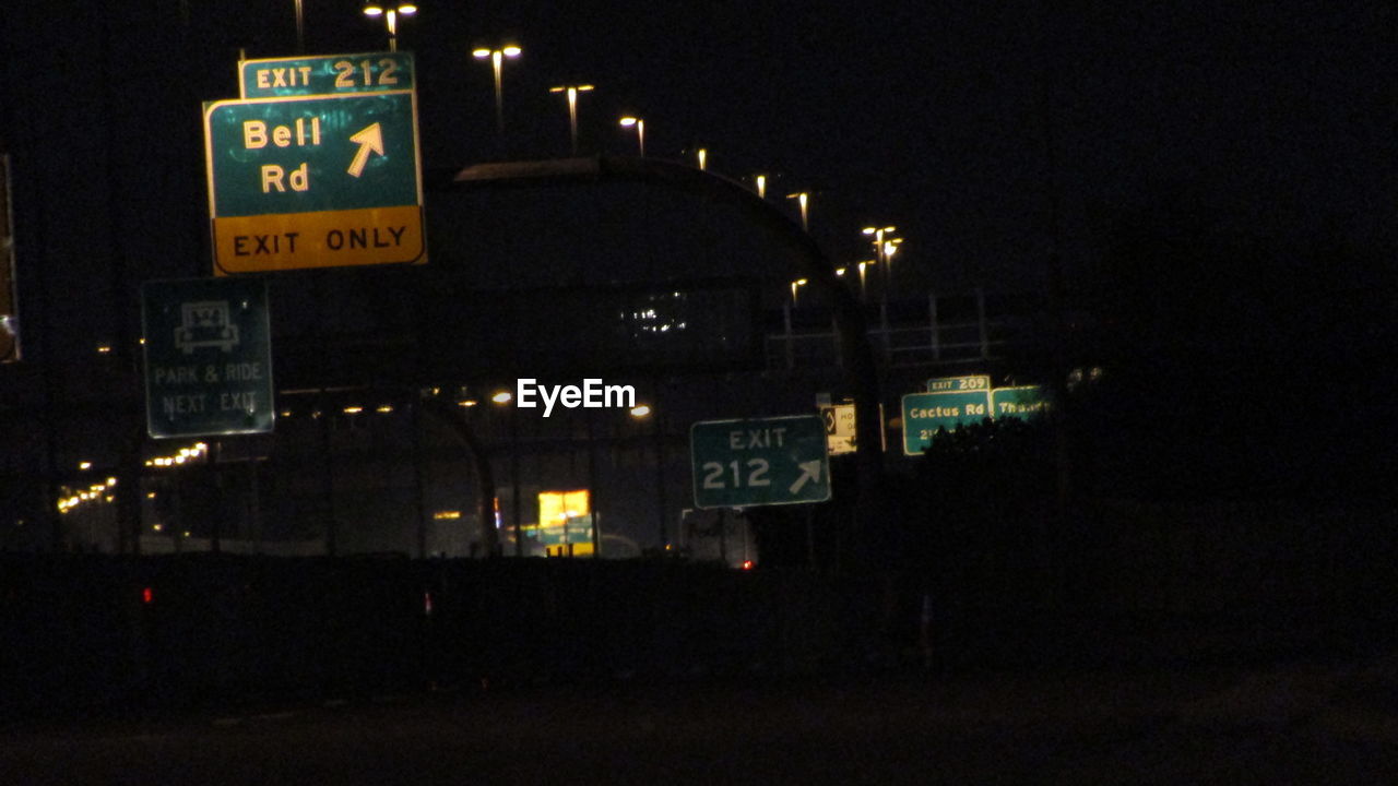 ROAD SIGN AT NIGHT