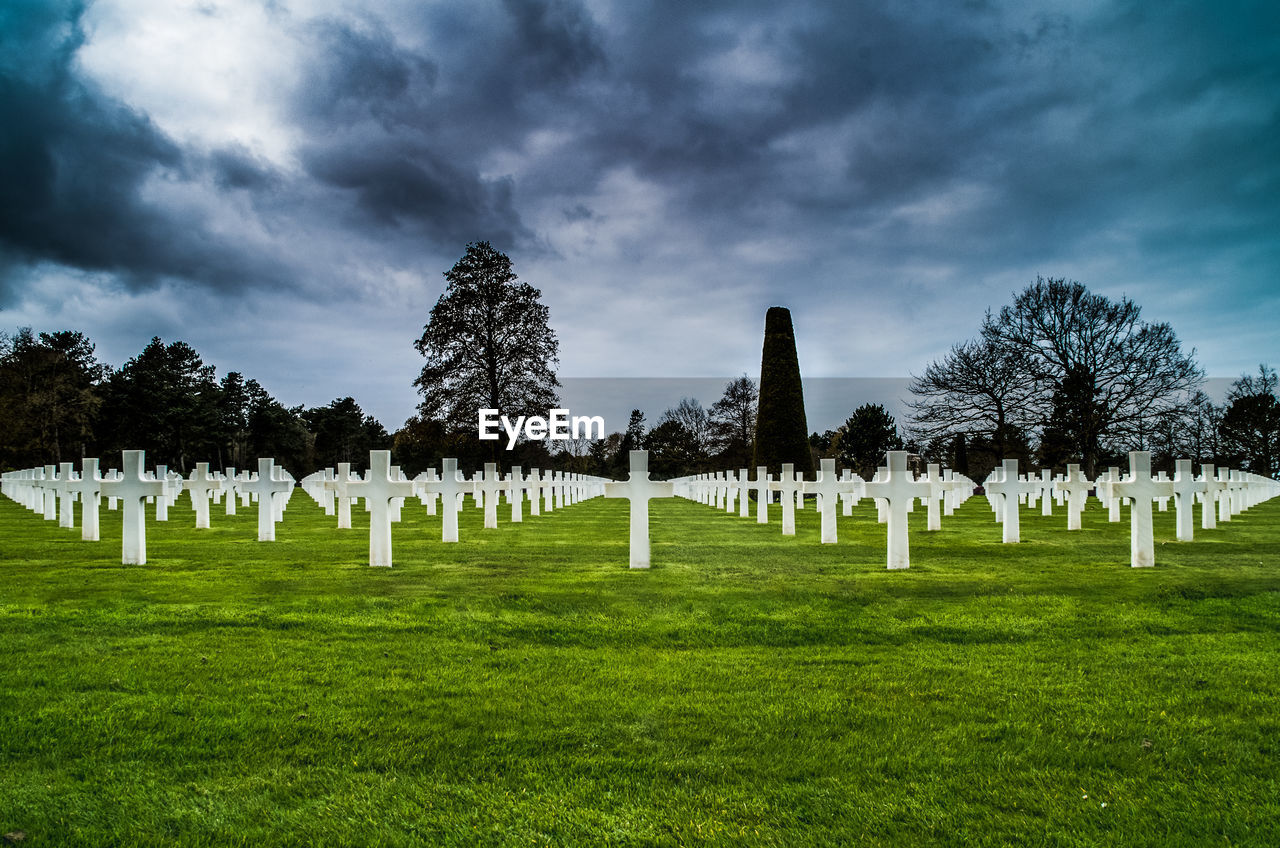 View of cemetery against cloudy sky