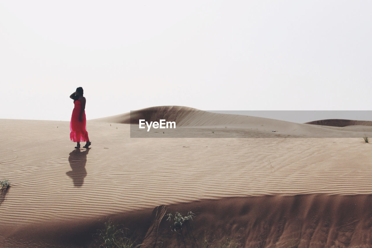 Woman walking in the desert