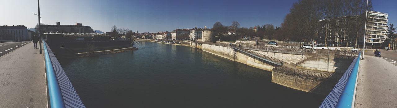 Panoramic view of river in city