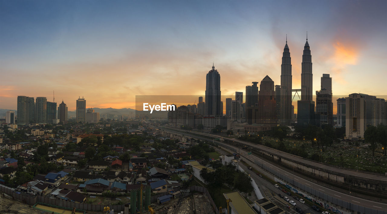 Cityscape against sky during sunset